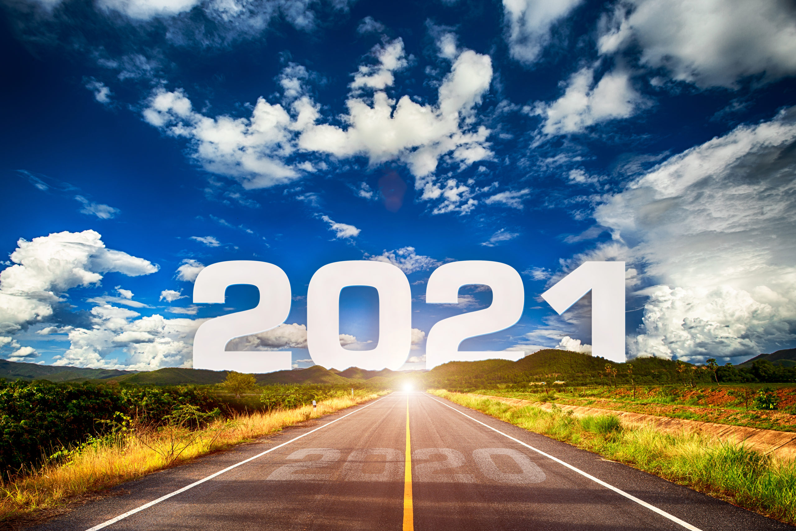 The Word 2021 Behind The Mountain Of Empty Asphalt Road At Golden Sunset And Beautiful Blue Sky. Concept For Vision Year 2021. By Atk Work Scaled